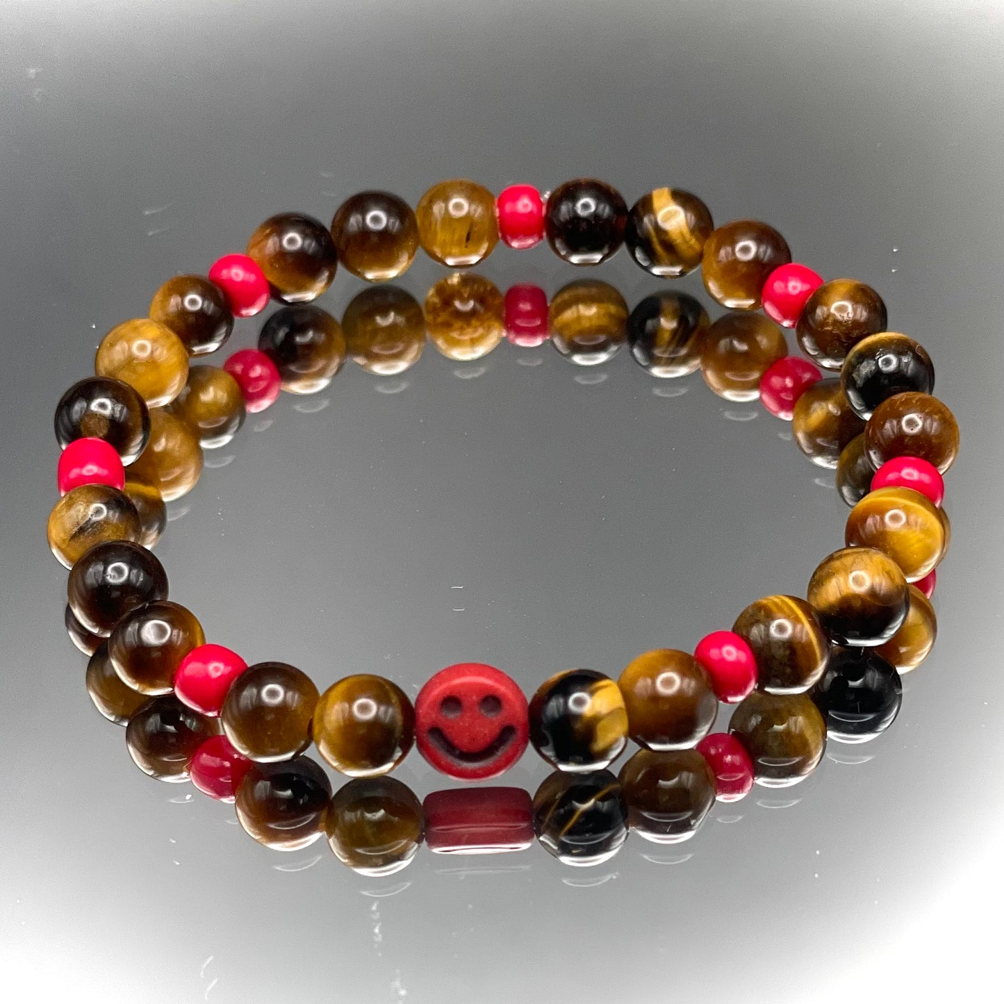 Armband Tigerauge „Mutmacher“ Kinder-Edition mit 6 mm Perlen und fröhlichem Gesicht