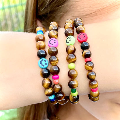 Armband Tigerauge „Mutmacher“ Kinder-Edition mit 6 mm Perlen und fröhlichem Gesicht