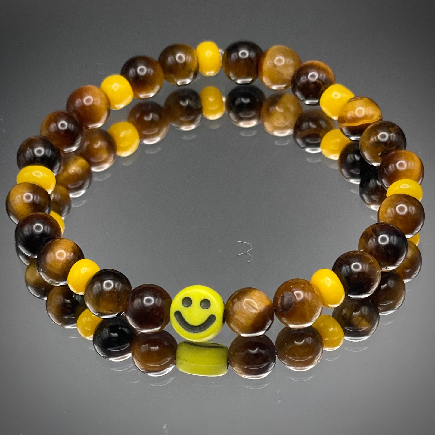 Armband Tigerauge „Mutmacher“ Kinder-Edition mit 6 mm Perlen und fröhlichem Gesicht